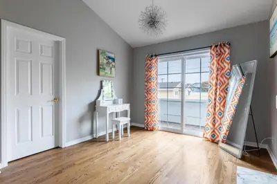a room with a door with a desk and a table at Tranquil family beach city retreat in Redondo Beach