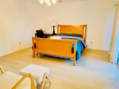 a bedroom with a bed and a bench in it at 1b1b Private and quiet sun roomA in Rancho Cucamonga