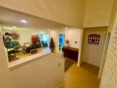 a living room with a christmas tree in the corner of a room at 1b1b Private and quiet sun roomA in Rancho Cucamonga