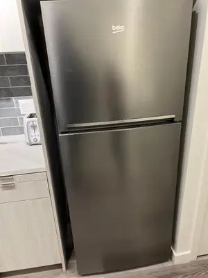 a stainless steel refrigerator in a kitchen at Heart of Hollywood-Walk of Fame 1bd Studio with View -Free parking, balcony, wifi, rooftop, gym, upscale amenities in Los Angeles