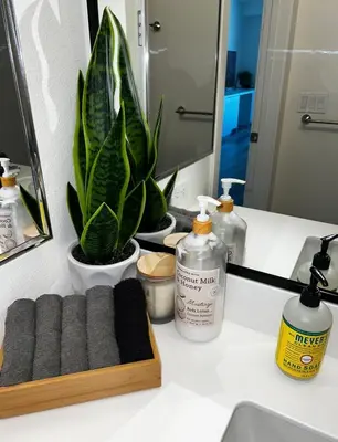a bathroom counter with a sink and a mirror at Heart of Hollywood-Walk of Fame 1bd Studio with View -Free parking, balcony, wifi, rooftop, gym, upscale amenities in Los Angeles