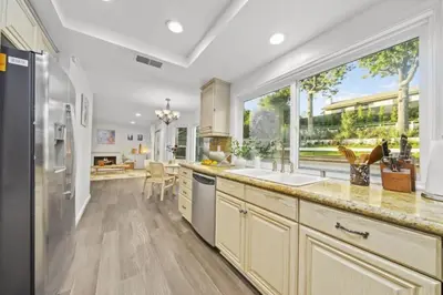 a kitchen with a sink and a large window at Luxe Sundance Villa 3BR with Pool and Spa Near Disney in Pomona