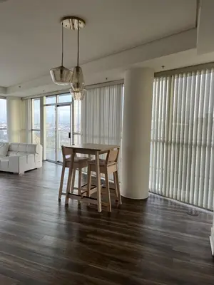 a dining room with a table and chairs and a couch at HollywoodNorth in Los Angeles