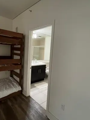 a bedroom with a bunk bed and a bathroom at HollywoodNorth in Los Angeles