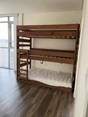 a bunk bed in a room with wooden bunk beds at NoHo in Los Angeles