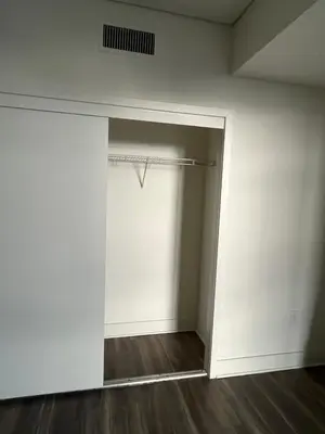 an empty room with a white wall and a closet at NoHo in Los Angeles