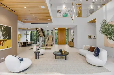 a living room with two white couches and a table at Hutton Modern in Beverly Hills