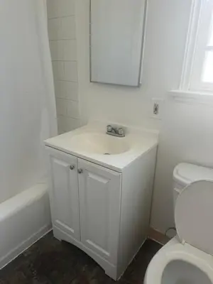 a white bathroom with a sink and a toilet at Cute room in best area of Hollywood in Los Angeles