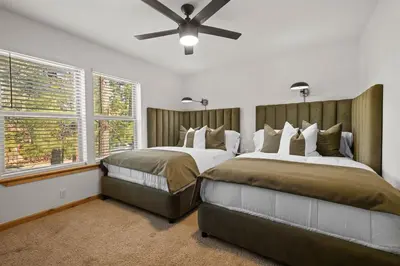 a bedroom with two beds and a ceiling fan at NEW Serenity Lodge Base Of Snow Summit Hot Tub in Big Bear Lake
