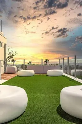 a rendering of a room with grass and a sunset at Modern Hollywood Walk of Fame Apts- Free Parking, 360 Rooftop, Pool, Gym- Centrally located in Los Angeles