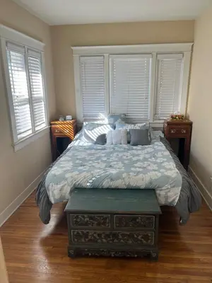 a bedroom with a large bed with pillows on it at Cozy One Bedroom Apartment in Los Angeles