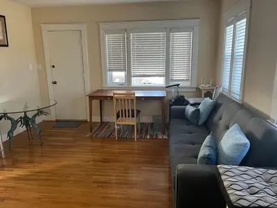 a living room with a couch and a table at Cozy One Bedroom Apartment in Los Angeles