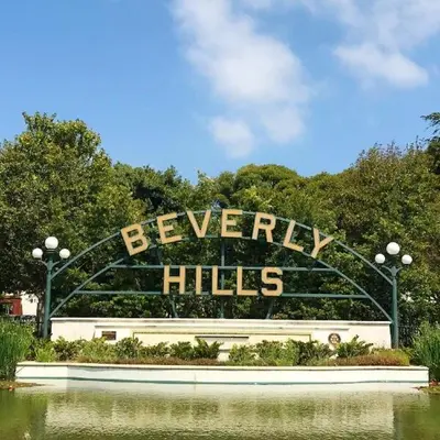 a sign that reads farewell halls in a park at Beverly Hills Charm Rodeo Cedar in Los Angeles