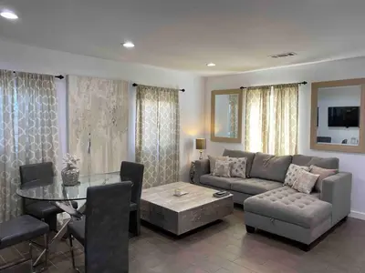 a living room with a couch and a table at Serene Sherman Oaks Cottage with Outdoor Space in Los Angeles