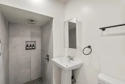 a white bathroom with a sink and a shower at Perfect 2BR Near Universal Studios By Poshguest in San Fernando
