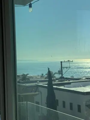a view of the ocean from a hotel window at Manhattan Beach Oasis in Manhattan Beach