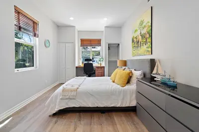 a bedroom with a bed and a desk in it at Los Angeles Large Mediteranian Vacation Home in Sherman Oaks Community Hospital Heliport