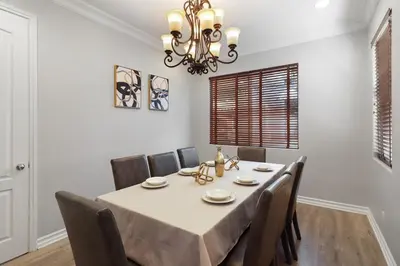 a dining room with a table and chairs at Los Angeles Large Mediteranian Vacation Home in Sherman Oaks Community Hospital Heliport