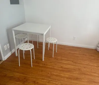 a white table and two stools in a room at Best location of Hollywood, great room in 2bdrm apt, walk of fame in Los Angeles