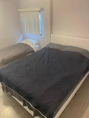 a bedroom with two beds and a window at West LA Chariton in Los Angeles