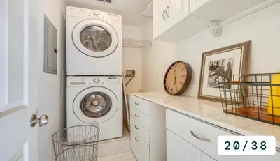 a white laundry room with a washer and dryer at Emeric Estate in Simi Valley