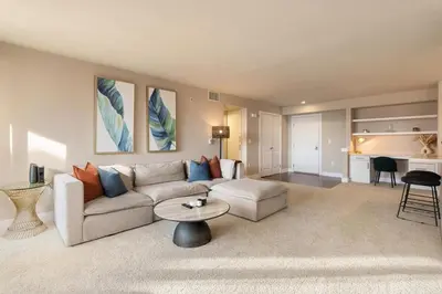 a living room with a couch and a table at The Citrine Suite - Water View Large Condo 2BR Marina in Los Angeles