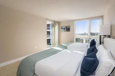 a bedroom with two beds and a large window at The Citrine Suite - Water View Large Condo 2BR Marina in Los Angeles
