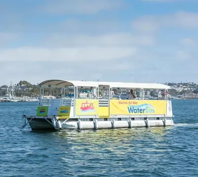 a yellow and white water bus on the water at The Citrine Suite - Water View Large Condo 2BR Marina in Los Angeles