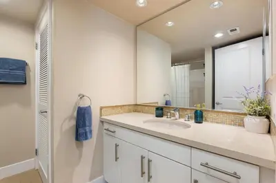 a bathroom with a sink and a mirror at The Citrine Suite - Water View Large Condo 2BR Marina in Los Angeles