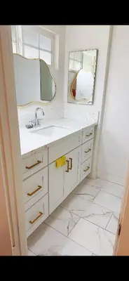 a white bathroom with a sink and a mirror at Pretty bedroom private bathroom in Hacienda Heights