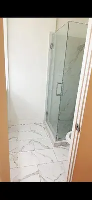 a bathroom with a glass shower and a toilet at Pretty bedroom private bathroom in Hacienda Heights