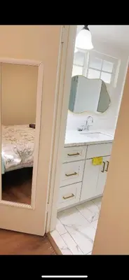 a bathroom with a sink and a mirror at Pretty bedroom private bathroom in Hacienda Heights