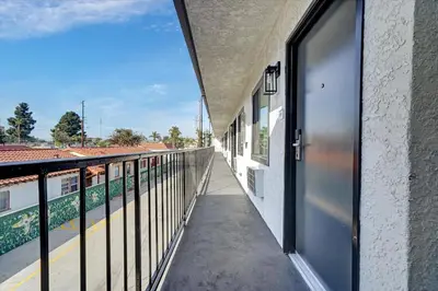 a balcony with a view of a train station at Casablanca Inn in Bell