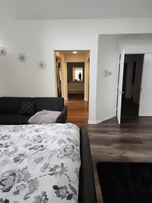 a bedroom with a bed and a living room at Travelers Mini Stays - Revelation Nation Welcome in Simi Valley