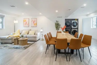 a dining room and living room with a table and chairs at Cozy Urban Retreat near Downtown LA & USC - Private room with shared Living room and kitchen in Los Angeles