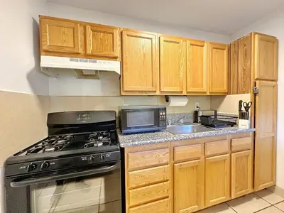 a kitchen with a black stove and a sink at Cozy 1-BR Poolside Getaway in West LA - LOU2 - WW in Los Angeles