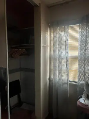 a room with a window with a curtain and a sink at Cheryls home in Inglewood