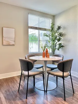 a dining room with a table and chairs at 2BD 2BA Santa Monica Apartment with Relaxing Pool View in Los Angeles