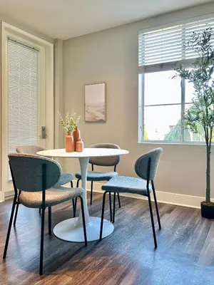 a dining room with a table and chairs at 2BD 2BA Santa Monica Apartment with Relaxing Pool View in Los Angeles