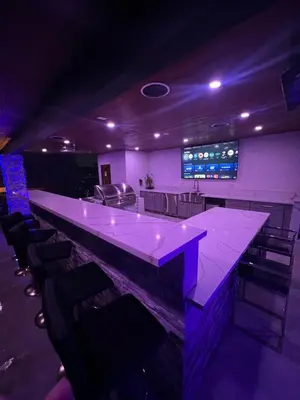 a bar with purple lighting in a room with chairs at Spacious 4-bedroom Glendora Super House in Glendora