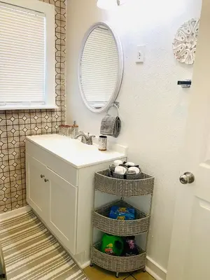 a bathroom with a sink and a mirror at Cozy Home Away From Home in Mojave