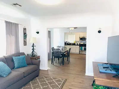 a living room with a couch and a table at Cozy Home Away From Home in Mojave