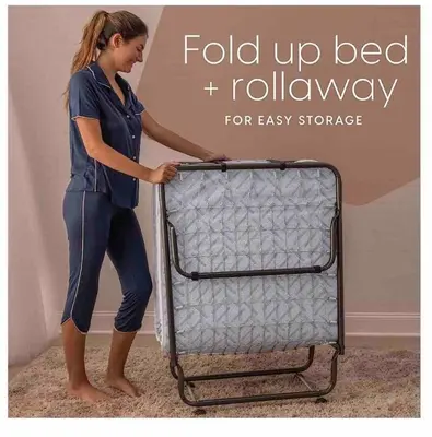 a woman is holding onto a luggage cart at Cozy Spacious, free parking, near it all in South Gate