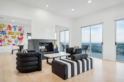 a living room with a couch and chairs and a fireplace at Hollywood Hills Luxury Nest in Los Angeles
