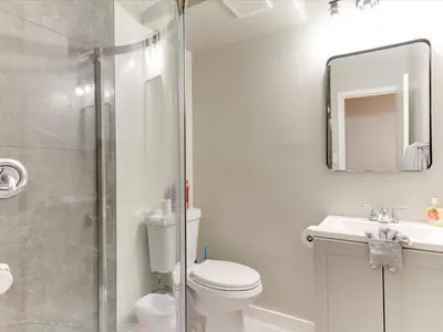a bathroom with a shower and a toilet and a sink at Modern 3 Bedroom Apartment in San Fernando in San Fernando
