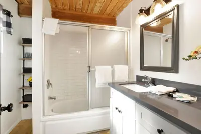 a bathroom with a shower and a sink at Village Relaxation at Camp Conklin Big Bear - Hot Tub in Big Bear Lake