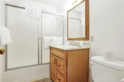 a bathroom with a sink and a mirror at Inspiration Point Retreat by Big Bear Vacations in Big Bear Lake