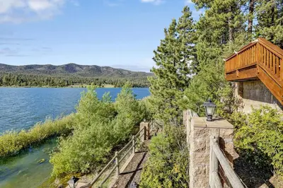 a house on the shore of a lake at Eagle Point Lake House by Big Bear Vacations in Big Bear Lake