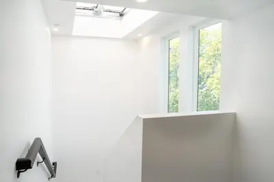 a bathroom with a sink and two windows at Urban Oasis in the Heart of LA Near USC & Major Attractions in Los Angeles