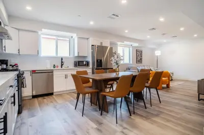 a kitchen and dining room with a table and chairs at Chic & Comfortable Space Near Downtown LA & USC in Los Angeles